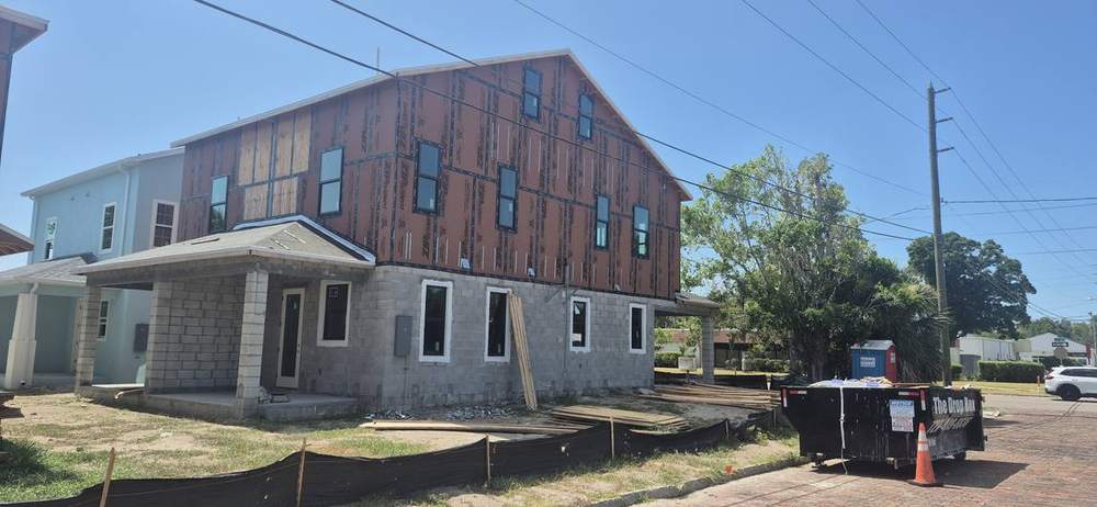 MMATGC framing work — Block first floor with framed, sheathed upper