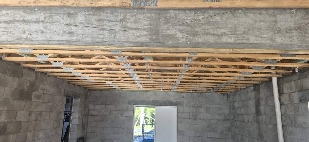 MMATGC framing work — Floor truss system over main level