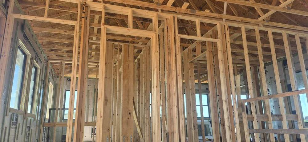 MMATGC framing work — Interior stud walls under vaulted trusses