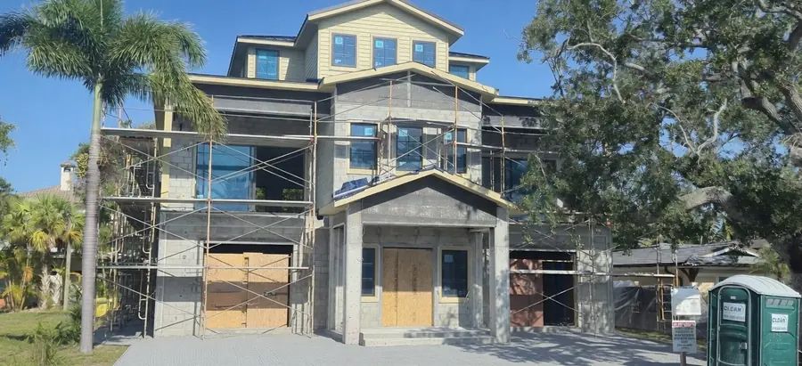 Front elevation of a custom home under construction by MMATGC in Tampa